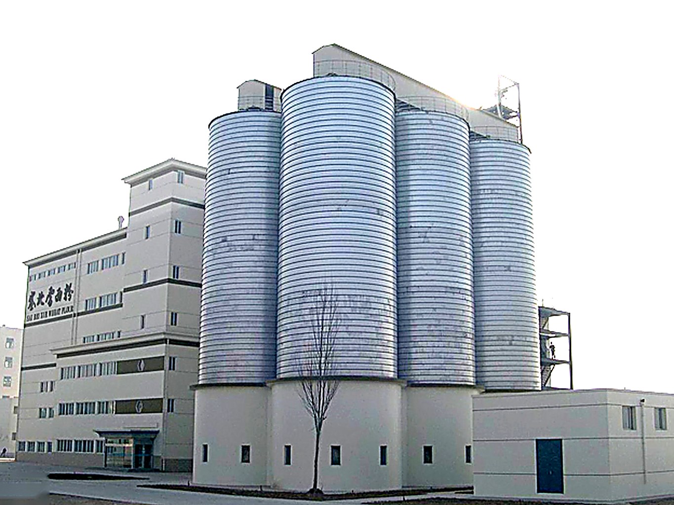 Spiral steel silos at an industrial aggregate storage site